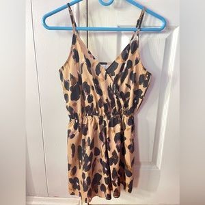 Small sized cheetah romper. Worn before.